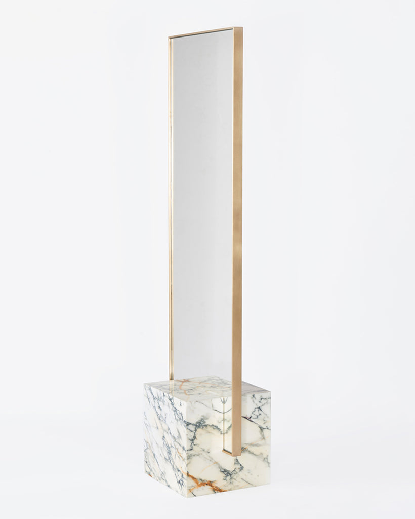 Standing mirror with white marble cube base and rectangular brass mirror frame