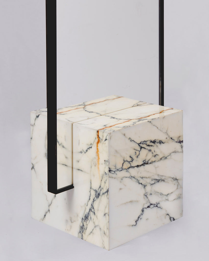 Cube base detail image of standing mirror with white marble base and blackened steel mirror frame